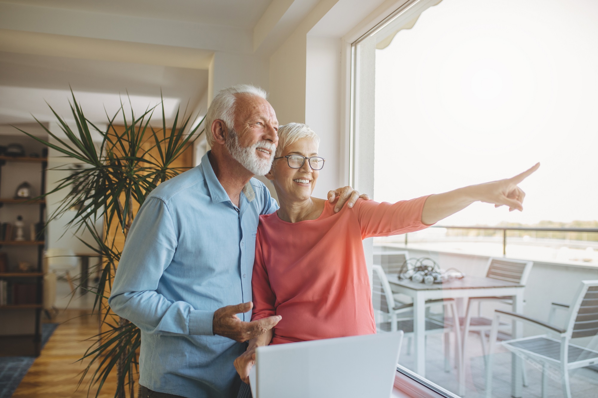 Senior couple looking at seaside sunset