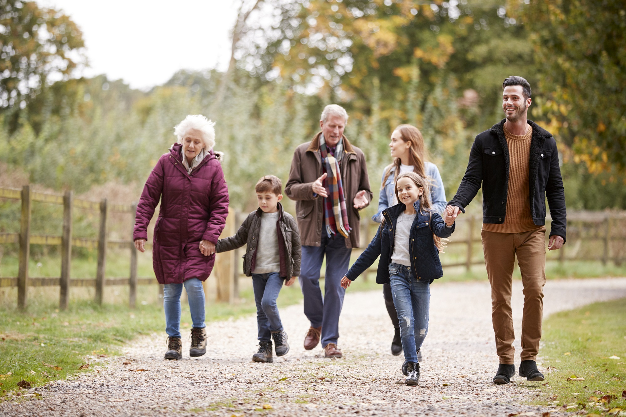 Multi Generation Family On Autumn Walk