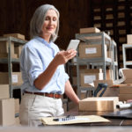 woman business owner at work shipping orders